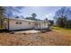 A ranch-style home with a light brick exterior and a covered patio at 4585 Yates Rd, Atlanta, GA 30337