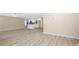 Open-concept living room with modern lighting, and laminate floors at 4585 Yates Rd, Atlanta, GA 30337