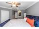 Bedroom featuring a bed, ceiling fan and recessed shelving and a full length mirror at 1850 Cotillion Dr # 4419, Atlanta, GA 30338