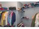 Walk-in closet with multiple shelves and storage for a lot of clothing at 1850 Cotillion Dr # 4419, Atlanta, GA 30338