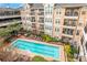 Aerial view of the pristine community pool, complete with lounge chairs and lush greenery at 1850 Cotillion Dr # 4419, Atlanta, GA 30338