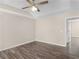 This bedroom features a vaulted ceiling, hardwood floors, neutral-colored walls, and a ceiling fan at 195 Brighton Dr, Covington, GA 30016