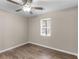 Relaxing bedroom featuring wood-look floors and a window, perfect for unwinding at 195 Brighton Dr, Covington, GA 30016