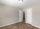 Neutral bedroom features wood-look floors, crisp white trim, and bright white doors at 195 Brighton Dr, Covington, GA 30016