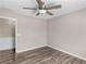 Cozy bedroom features a ceiling fan, hardwood floors, and fresh paint at 195 Brighton Dr, Covington, GA 30016