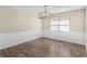 Bright dining room with wood floors, modern light fixture, and large window at 195 Brighton Dr, Covington, GA 30016