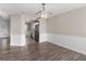 Open floor plan dining room with wood floors and view to the kitchen at 195 Brighton Dr, Covington, GA 30016