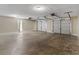 Spacious two-car garage featuring bright lighting and neutral paint colors for a clean, modern feel at 195 Brighton Dr, Covington, GA 30016