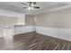 Spacious living room featuring wood floors and an open floor plan, leading to the front door at 195 Brighton Dr, Covington, GA 30016