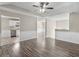 Spacious living room featuring wood floors and an open floor plan, leading into the kitchen at 195 Brighton Dr, Covington, GA 30016