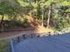 View of the backyard and woods from the deck at 2015 Aldbury Ln, Woodstock, GA 30189