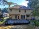 View of a back exterior showing a deck and large windows at 2015 Aldbury Ln, Woodstock, GA 30189