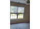 Neutral bedroom features a gray carpet, blinds, and ceiling fan at 2015 Aldbury Ln, Woodstock, GA 30189