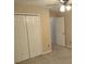 Bedroom features double closets, and a ceiling fan at 2015 Aldbury Ln, Woodstock, GA 30189