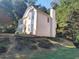 A pleasing exterior elevation shows landscaping and hardscaping at 2015 Aldbury Ln, Woodstock, GA 30189