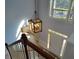 This foyer showcases a pendant light fixture and a staircase at 2015 Aldbury Ln, Woodstock, GA 30189