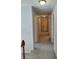 A carpeted hallway provides access to multiple rooms at 2015 Aldbury Ln, Woodstock, GA 30189