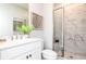 Modern bathroom with a glass-enclosed shower, neutral tiling, and contemporary fixtures at 337 Skylar Se Way, Atlanta, GA 30315