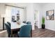 Dining room with a table set for six, adjacent to a powder room at 337 Skylar Se Way, Atlanta, GA 30315