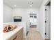 Bright hallway with modern decor and a view of a bedroom through an open doorway at 337 Skylar Se Way, Atlanta, GA 30315