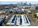 A bird's-eye view of the property surrounded by the city and lush trees at 400 Village Ne Pkwy # 114, Atlanta, GA 30306