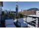 Cozy balcony area with seating and city skyline views for ultimate outdoor relaxation at 400 Village Ne Pkwy # 114, Atlanta, GA 30306