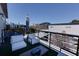 Balcony with furniture and an umbrella offers an outdoor living space with city views at 400 Village Ne Pkwy # 114, Atlanta, GA 30306