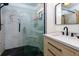 Modern bathroom features a glass shower with marble tile, black hardware, and a sleek vanity at 400 Village Ne Pkwy # 114, Atlanta, GA 30306