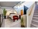 Open bedroom loft with a cozy bed, vibrant red chairs, and contemporary decor at 400 Village Ne Pkwy # 114, Atlanta, GA 30306