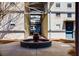 Charming courtyard featuring a lovely water fountain surrounded by well-maintained grounds and corrugated steel siding at 400 Village Ne Pkwy # 114, Atlanta, GA 30306