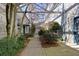 A tranquil courtyard showcasing lush landscaping and architectural details, creating a serene outdoor environment at 400 Village Ne Pkwy # 114, Atlanta, GA 30306
