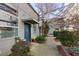 Charming front entrance with a blue door, complemented by lush greenery, creating an inviting entryway at 400 Village Ne Pkwy # 114, Atlanta, GA 30306