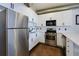 Contemporary kitchen with stainless steel appliances, white cabinets, and modern fixtures at 400 Village Ne Pkwy # 114, Atlanta, GA 30306