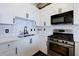 Well-appointed kitchen featuring modern appliances, sleek countertops, and ample cabinet space at 400 Village Ne Pkwy # 114, Atlanta, GA 30306