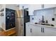 Bright kitchen with white cabinets, stainless steel appliances, and a chalkboard wall for creative expression at 400 Village Ne Pkwy # 114, Atlanta, GA 30306