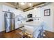 Modern kitchen featuring white cabinets, stainless steel appliances, and a functional island at 400 Village Ne Pkwy # 114, Atlanta, GA 30306