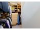 Well-organized walk-in closet featuring shelving and hanging space, providing ample storage at 400 Village Ne Pkwy # 114, Atlanta, GA 30306