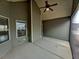 Enclosed back porch featuring a ceiling fan and outdoor lighting at 42 Champions Crossing, Villa Rica, GA 30180