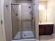 Bathroom featuring shower stall and single sink vanity with cabinets at 42 Champions Crossing, Villa Rica, GA 30180