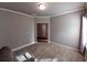 Inviting bedroom featuring neutral walls, carpet, and plenty of light at 42 Champions Crossing, Villa Rica, GA 30180