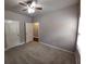 Bedroom with carpet flooring, ceiling fan, and one window allowing for natural lighting at 42 Champions Crossing, Villa Rica, GA 30180