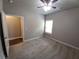 Bedroom with carpet flooring, ceiling fan, and one window allowing for natural lighting at 42 Champions Crossing, Villa Rica, GA 30180