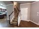 Bright entryway features hardwood floors, stairway, and a white door at 42 Champions Crossing, Villa Rica, GA 30180