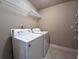 Convenient laundry room with appliances, shelving, and ample space at 42 Champions Crossing, Villa Rica, GA 30180