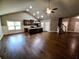 Open-concept living room with hardwood floors and bright, natural lighting at 42 Champions Crossing, Villa Rica, GA 30180