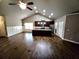 Open-concept living room and kitchen with hardwood floors and ample natural light at 42 Champions Crossing, Villa Rica, GA 30180