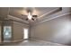 Bright main bedroom featuring a ceiling fan and back door offering access to the outdoors at 42 Champions Crossing, Villa Rica, GA 30180