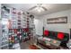 Showcasing organized shelves displaying shoe and hat collection alongside seating area with sofa and glass table at 15 Corinth Rd, Cartersville, GA 30121