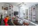 Organized room featuring curated shoe collection on shelves, a seating area with sofa, and a flat screen TV at 15 Corinth Rd, Cartersville, GA 30121