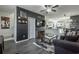 Inviting living room featuring open layout, dark accent wall and comfortable seating with a glass coffee table at 15 Corinth Rd, Cartersville, GA 30121